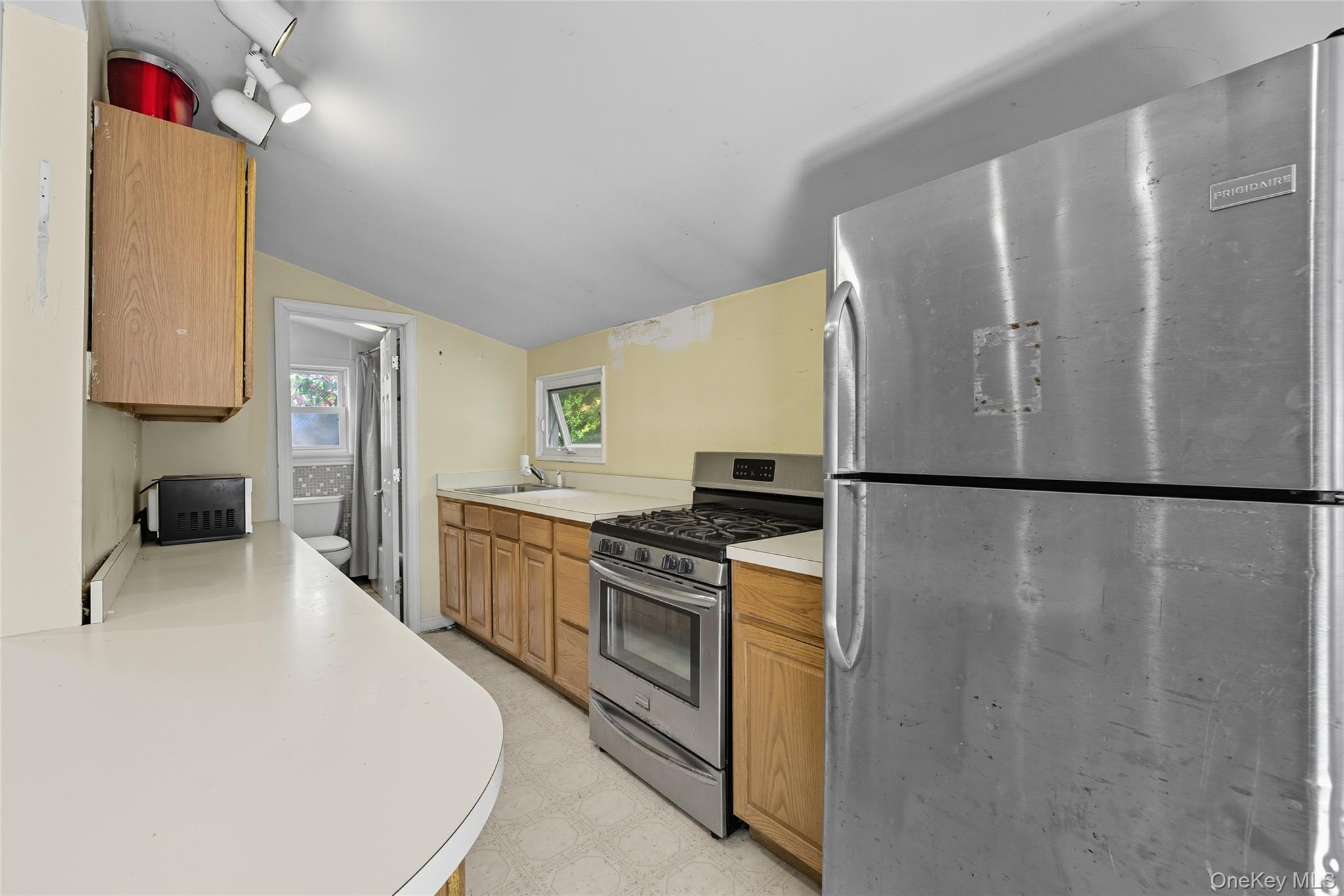 13 Darien Road Carmel, NY 10512 - Photo 11 of 17 a kitchen with stainless steel appliances granite countertop a refrigerator a stove and a sink