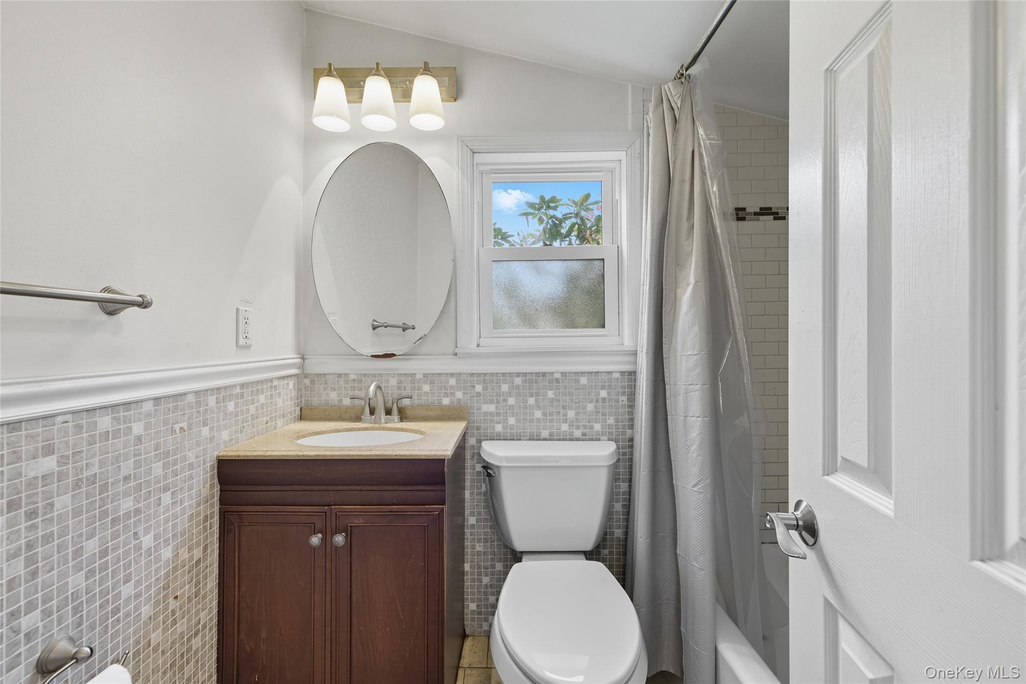 13 Darien Road Carmel, NY 10512 - Photo 12 of 17 a bathroom with a toilet sink and mirror
