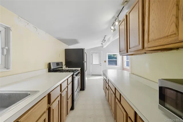 a kitchen with a sink and counter top space