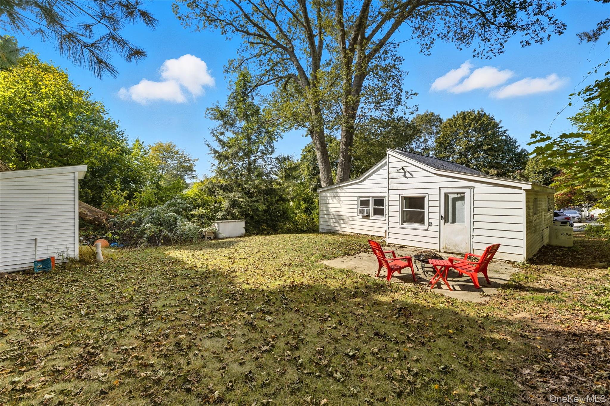 13 Darien Road Carmel, NY 10512 - Photo 3 of 17 a backyard of a house with table and chairs