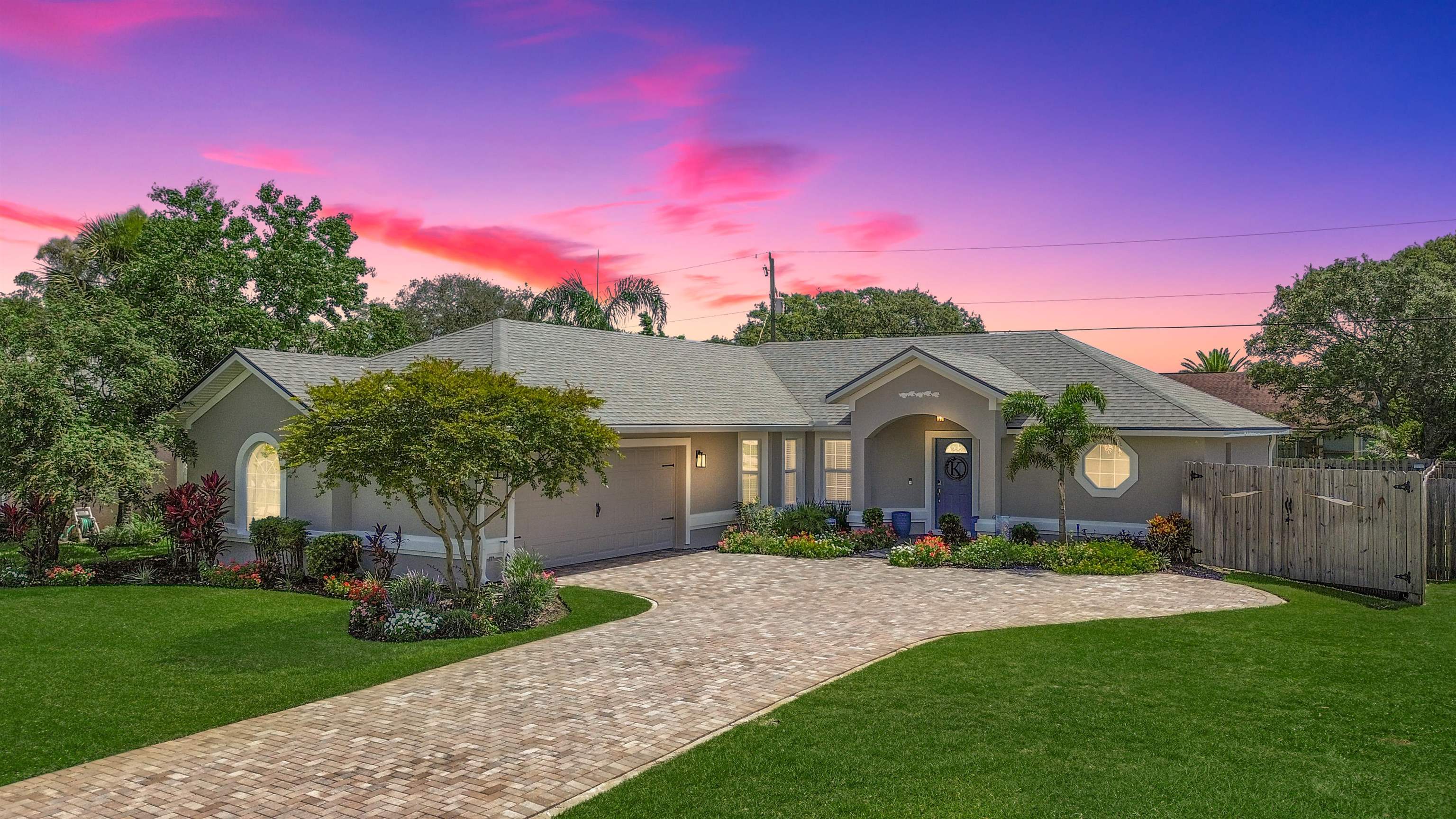 5324 5th Street St. Augustine, FL 32080 - Photo 1 of 49 a front view of a house with a garden and yard