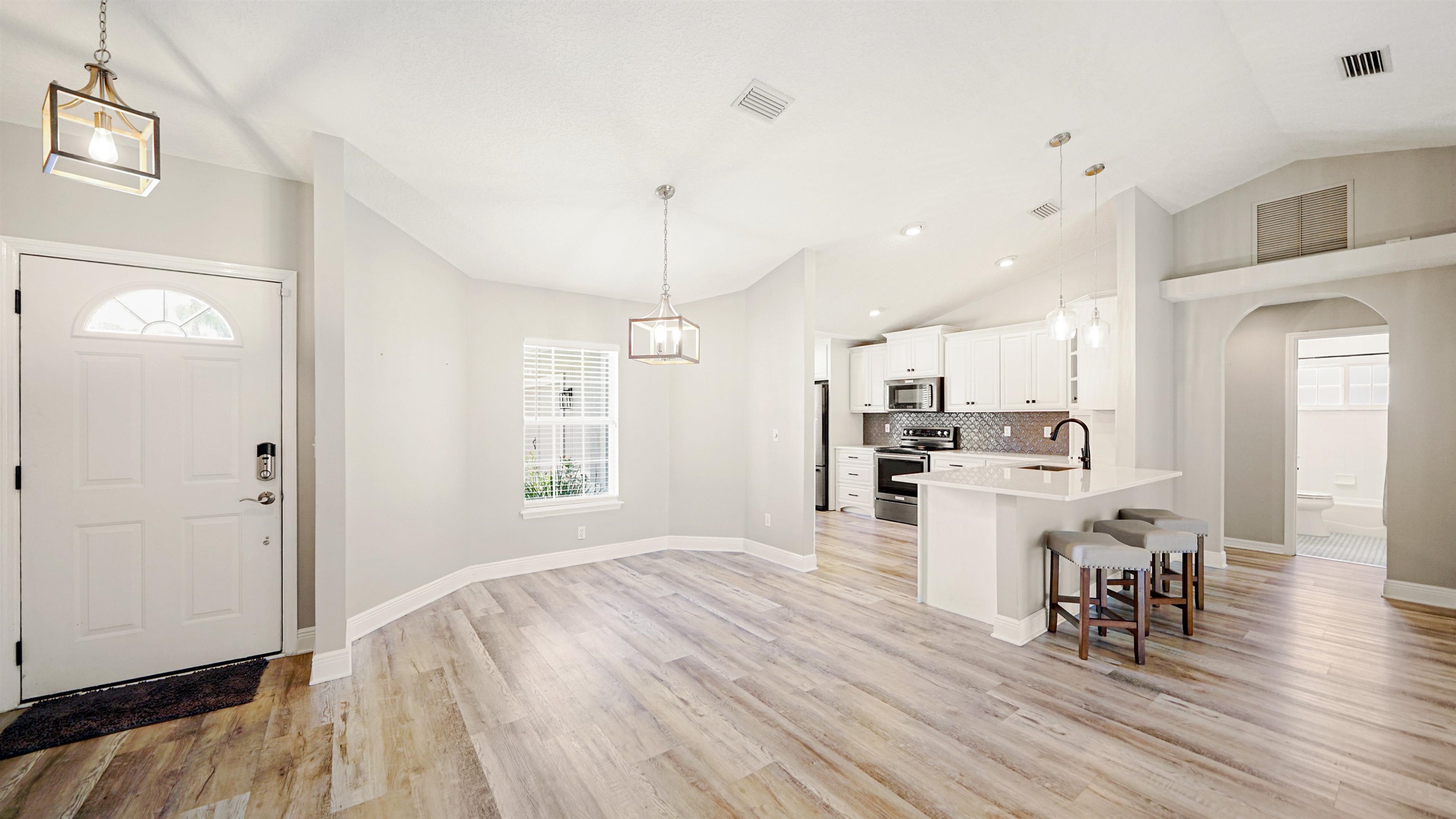 5324 5th Street St. Augustine, FL 32080 - Photo 12 of 49 a living room with furniture and kitchen view