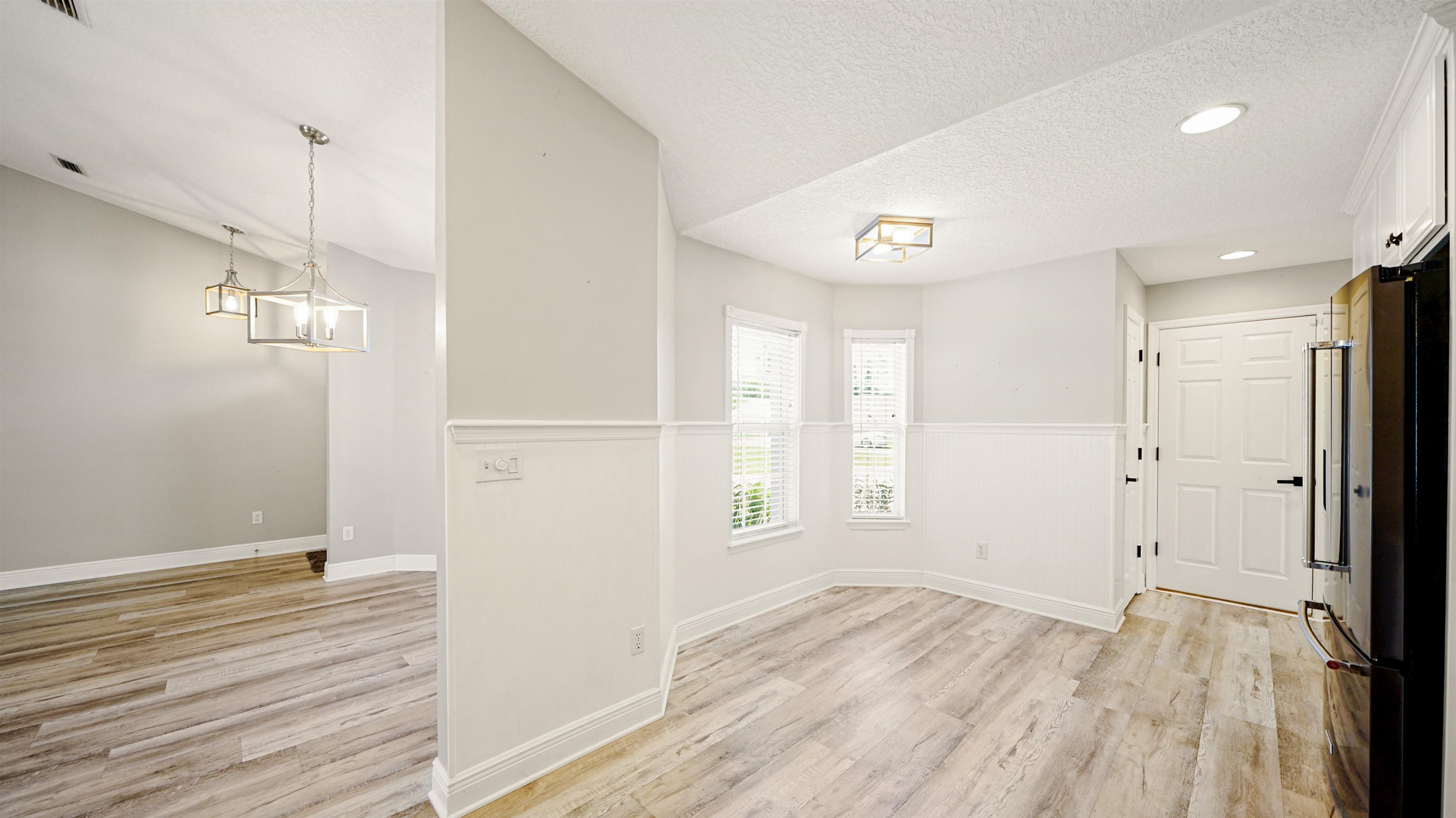 5324 5th Street St. Augustine, FL 32080 - Photo 14 of 49 a view of empty room with wooden floor and window