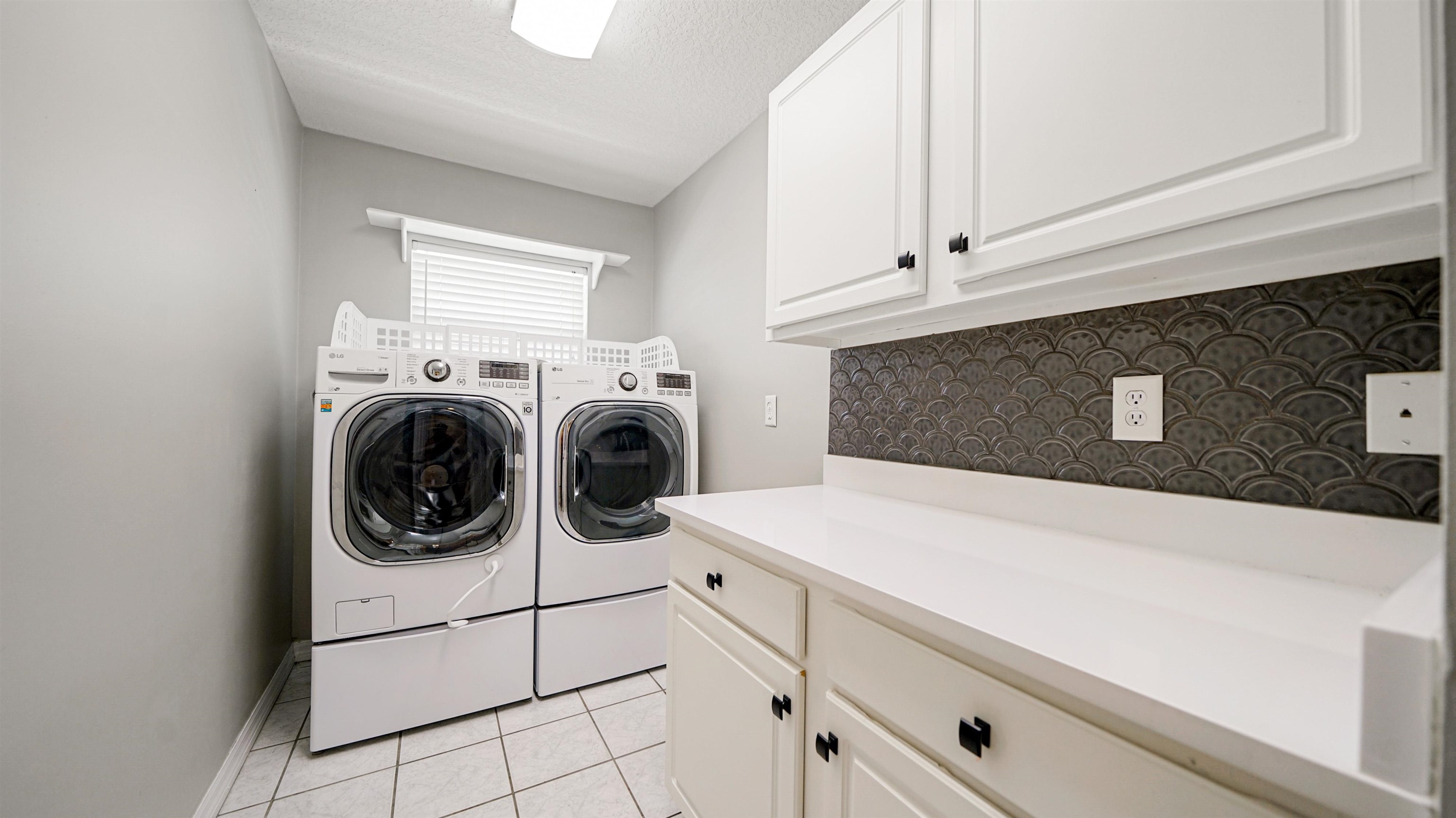 5324 5th Street St. Augustine, FL 32080 - Photo 16 of 49 a utility room with dryer and washer