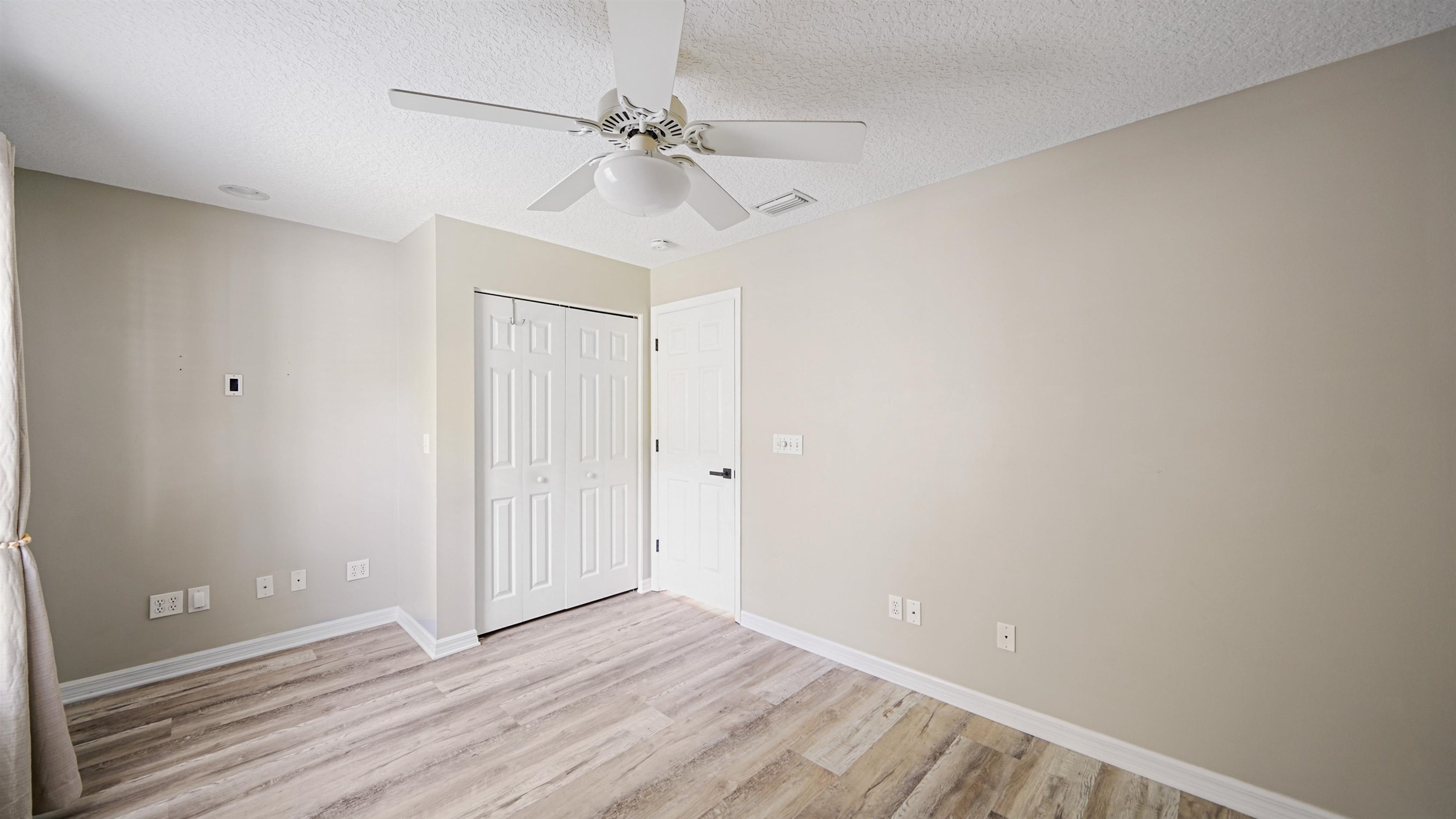5324 5th Street St. Augustine, FL 32080 - Photo 29 of 49 a view of an empty room with wooden floor