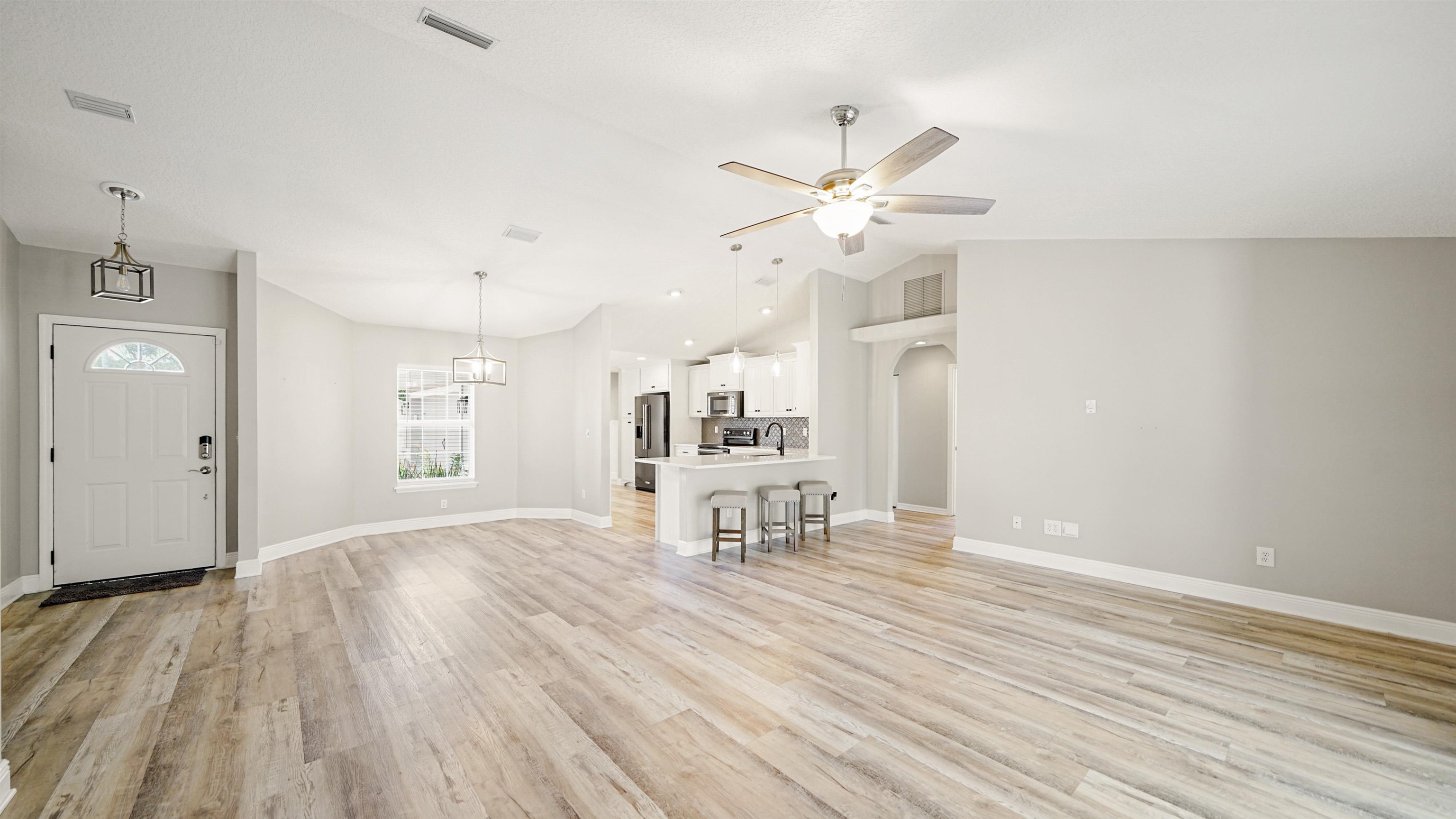 5324 5th Street St. Augustine, FL 32080 - Photo 8 of 49 an empty room with wooden floor and windows