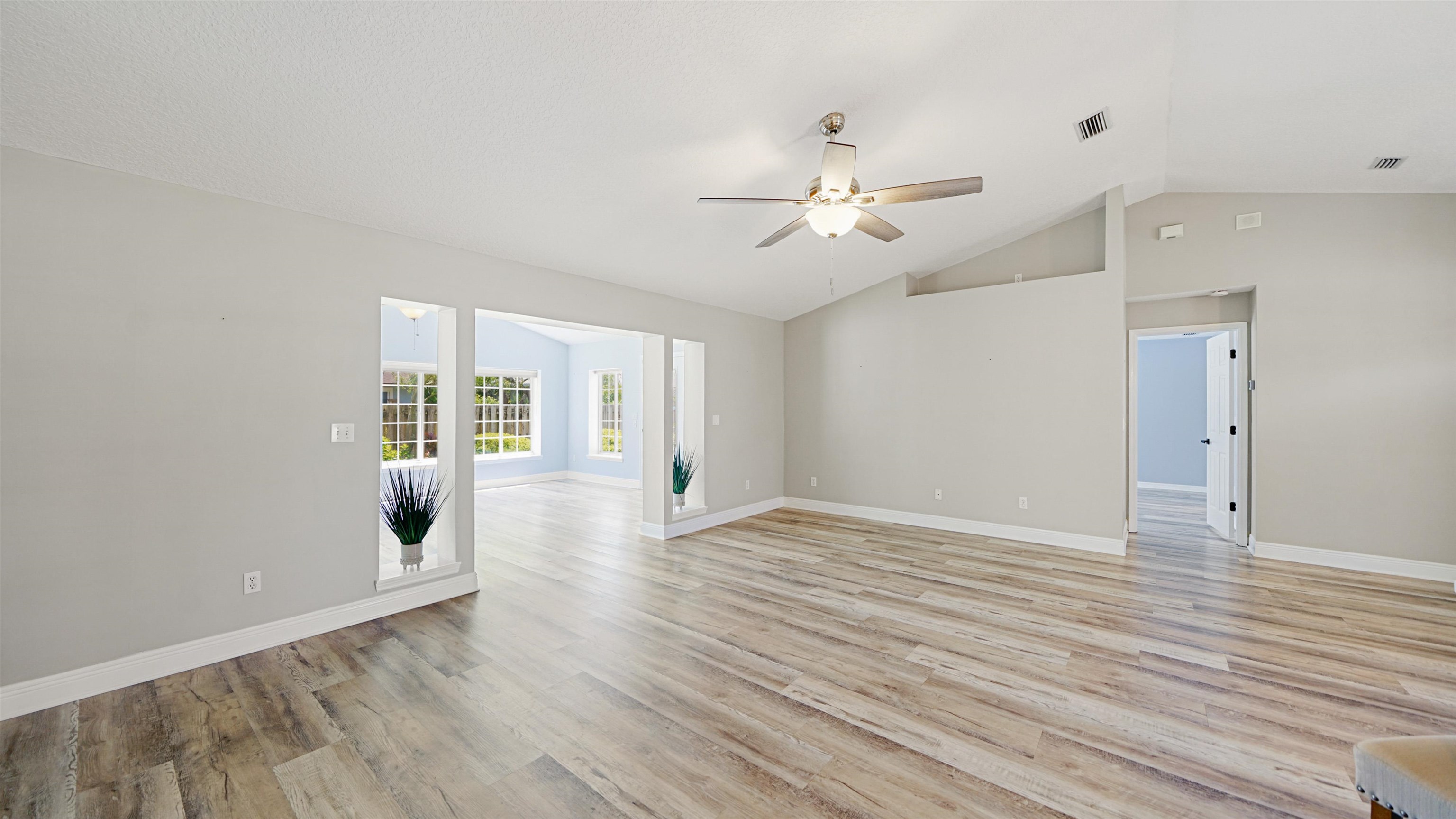 5324 5th Street St. Augustine, FL 32080 - Photo 9 of 49 a view of an empty room with wooden floor and a window