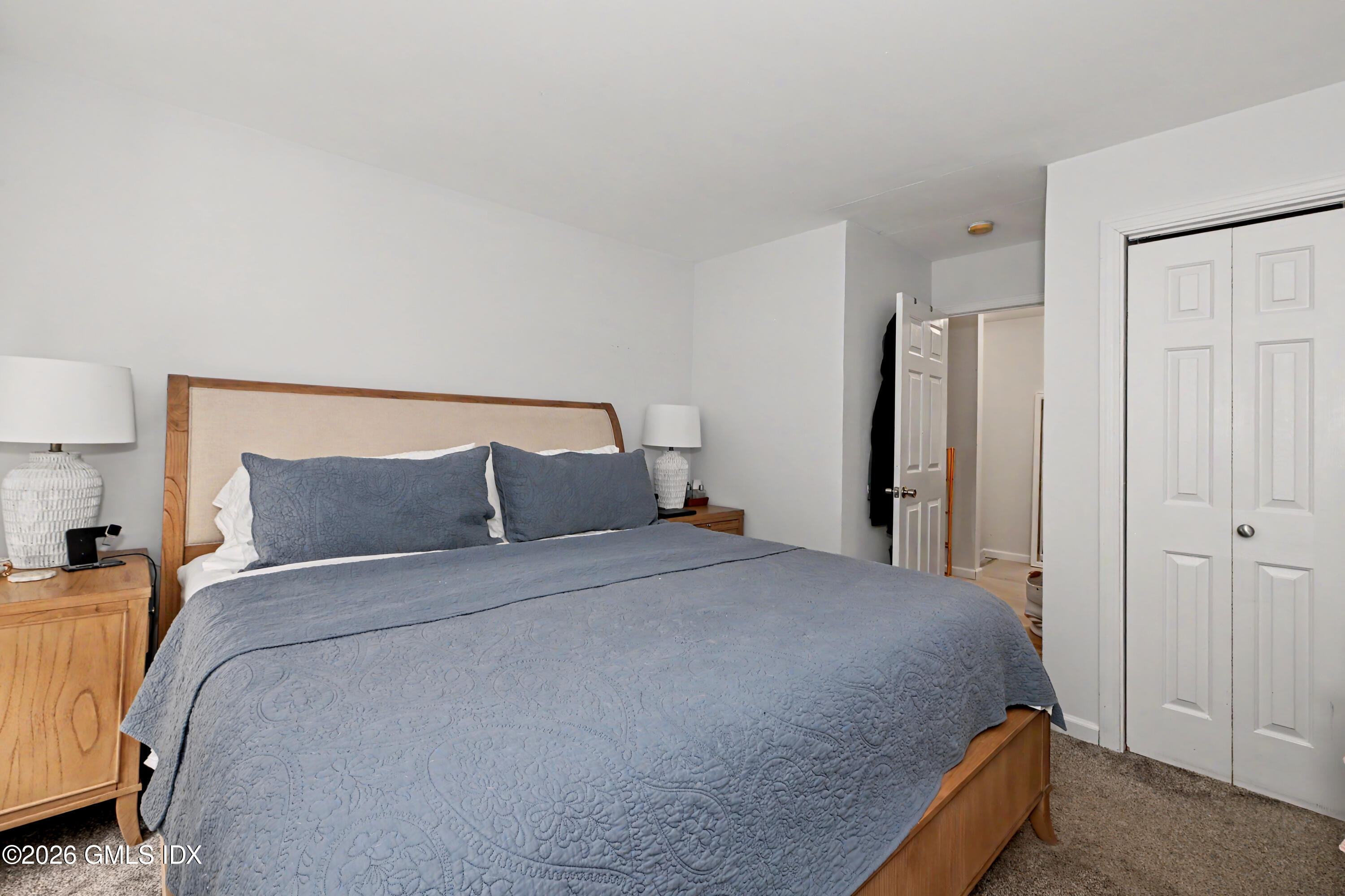 37 Prospect Street Greenwich, CT 06830 - Photo 15 of 41 a large bed sitting in a bedroom next to a cabinet