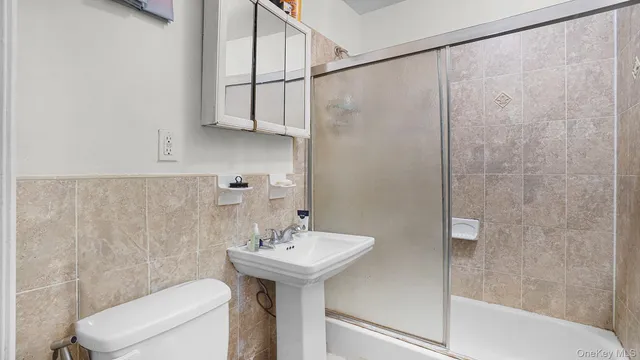 a living room with furniture and a large mirror