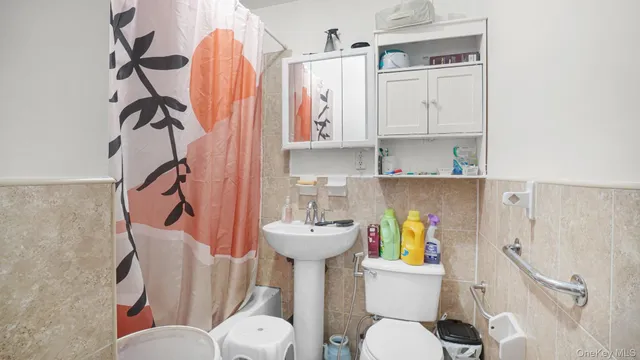 a kitchen with a refrigerator and cabinets