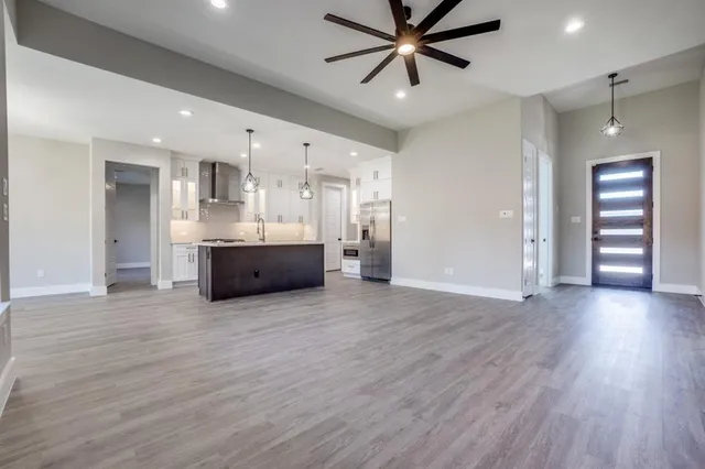 a view of a kitchen with a sink and a window