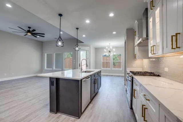 a kitchen with a stove and a sink