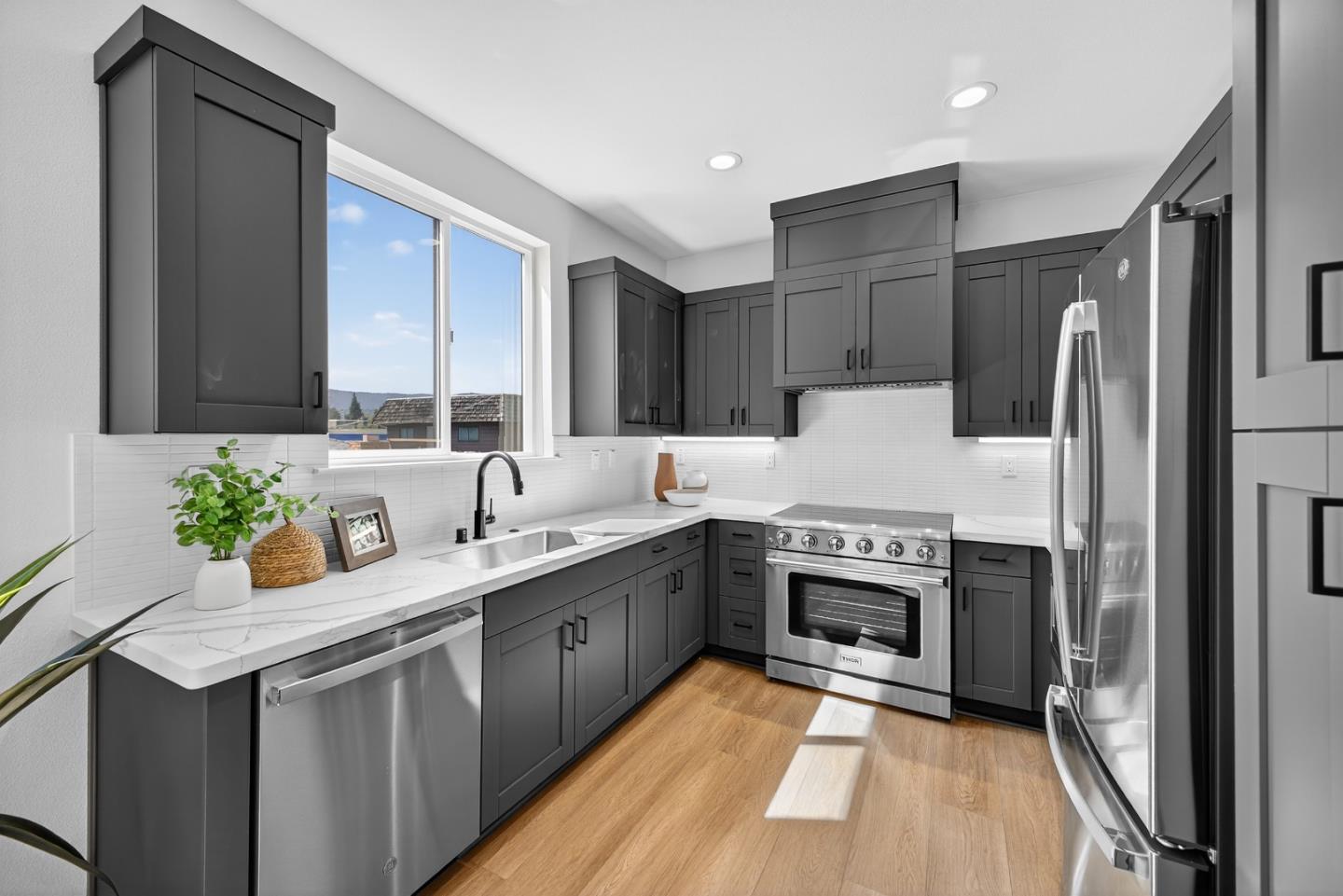 955 Woodside Road Redwood City, CA 94061 - Photo 45 of 46 a kitchen with a sink stove and refrigerator