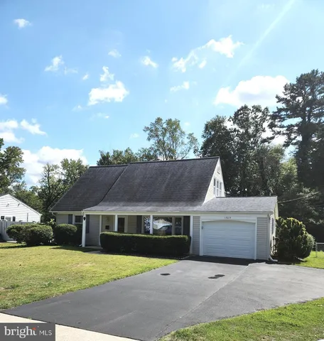 a view of house with yard and street view
