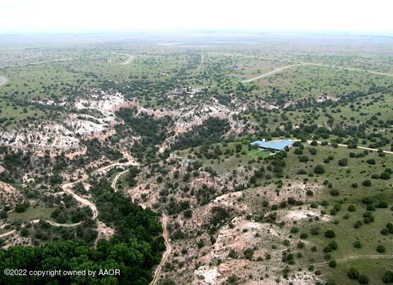 210 Prairie Canyon Canyon, TX 79015 - Photo 5 of 5 an aerial view of house with yard and mountain view in back