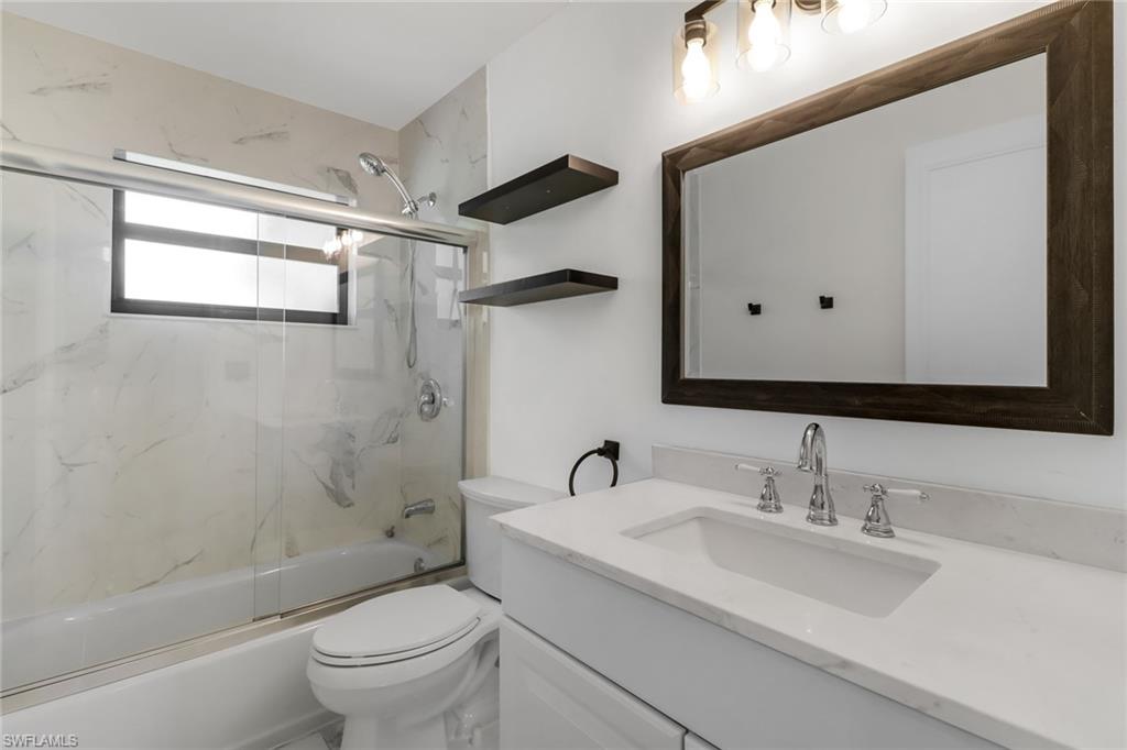 18659 Sarasota Road Fort Myers, FL 33967 - Photo 13 of 19 a bathroom with a sink toilet and shower