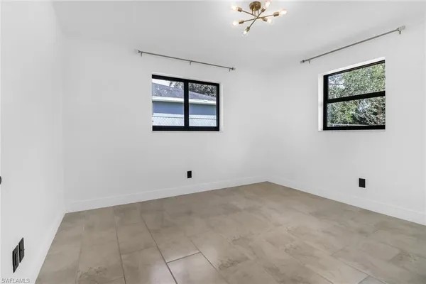 an empty room with a fan