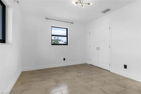 an empty room with windows