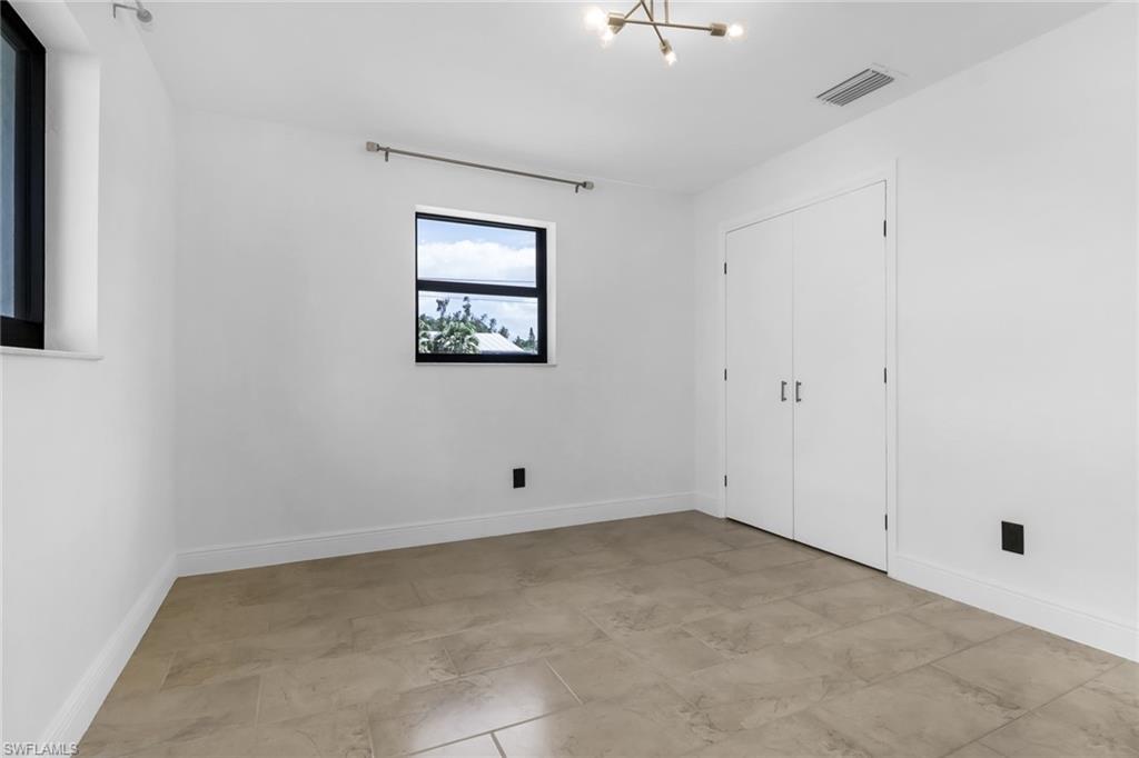 18659 Sarasota Road Fort Myers, FL 33967 - Photo 15 of 19 an empty room with windows