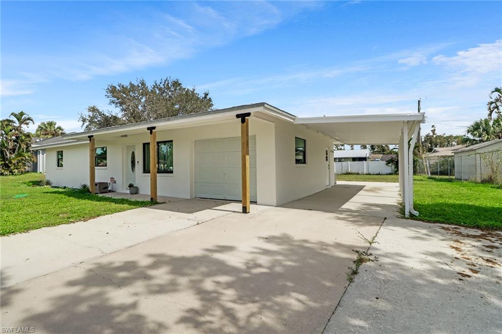 18659 Sarasota Road Fort Myers, FL 33967 - Photo 3 of 19 a view of a parking space in front of a house