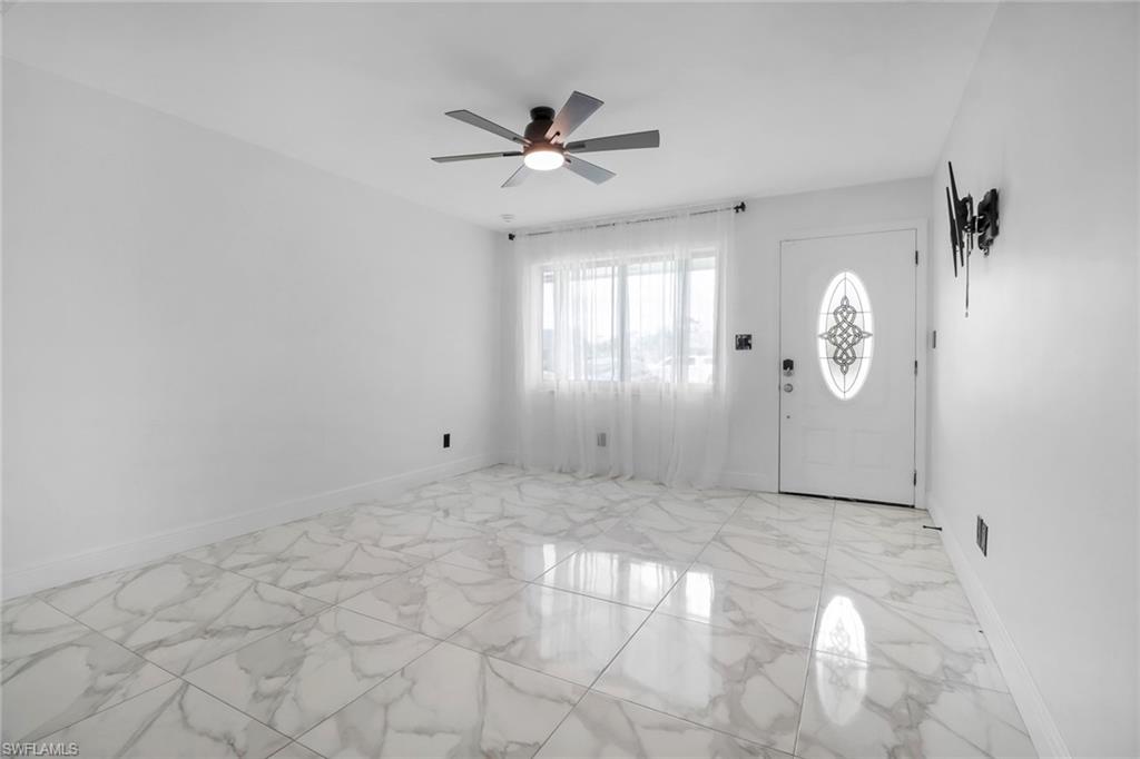 18659 Sarasota Road Fort Myers, FL 33967 - Photo 6 of 19 a view of a livingroom with a chandelier fan