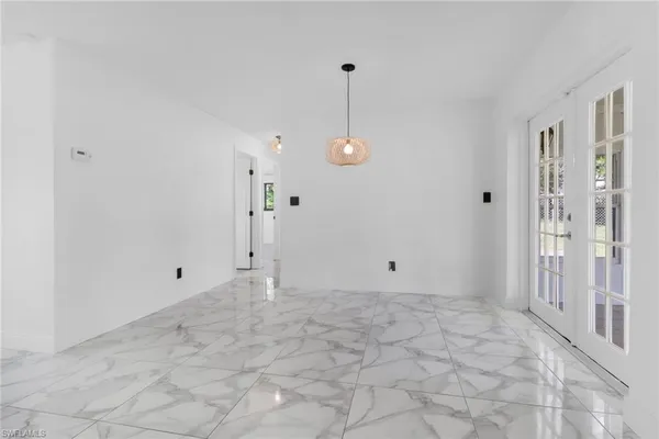 a view of an empty room and window