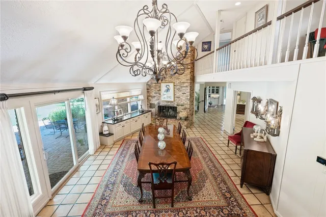 a view of a dining room with furniture wooden floor and chandelier
