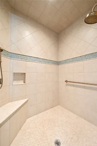 a bathroom with a bathtub and shower
