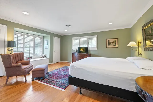 a bed room with a bed window and a couch