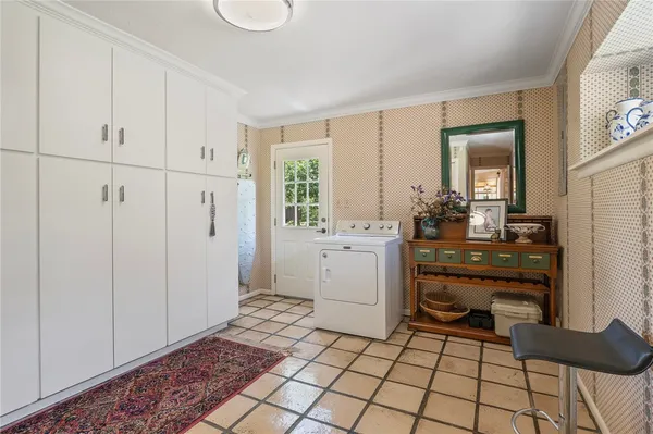 a room with a baby crib and a dresser