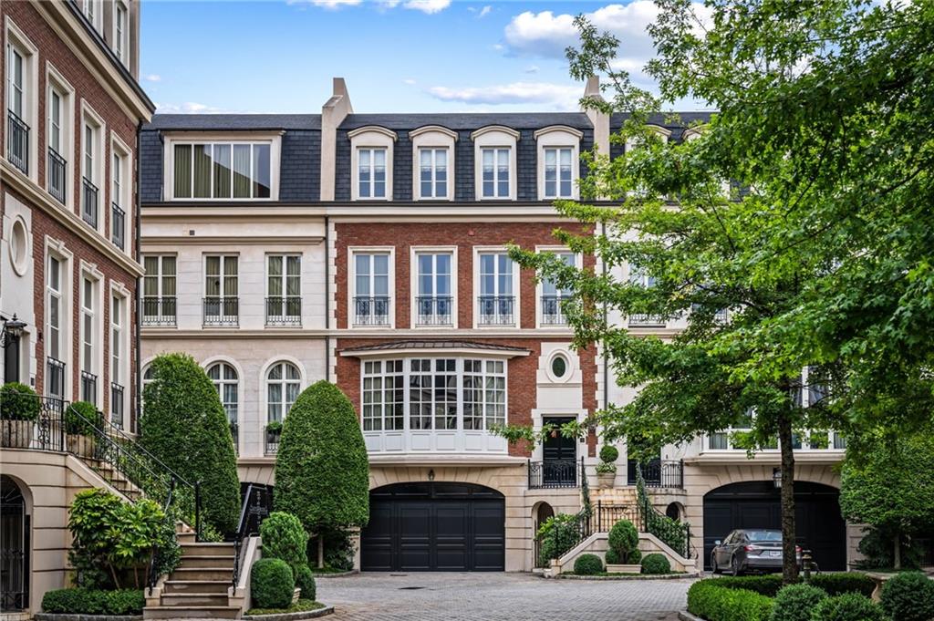 a front view of a building with garden