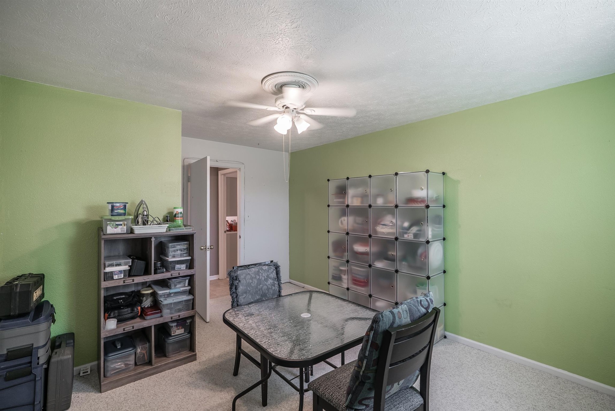 6842 Bethel Road Greenbrier, TN 37073 - Photo 21 of 30 a view of a dining room with furniture and chandelier fan