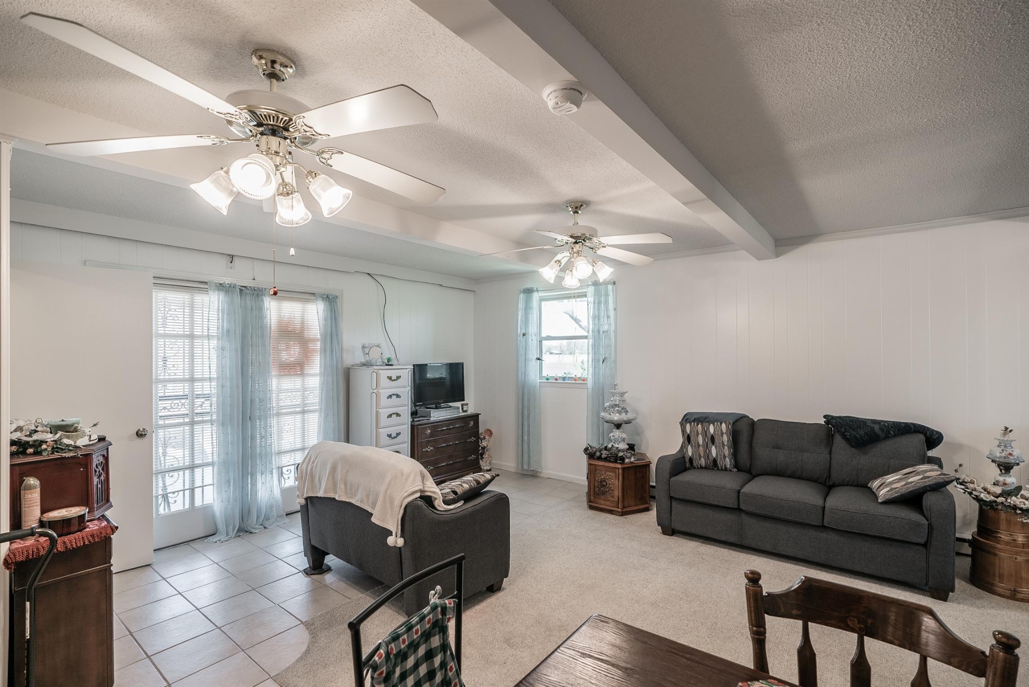 6842 Bethel Road Greenbrier, TN 37073 - Photo 24 of 30 a living room with furniture a chandelier fan and a window