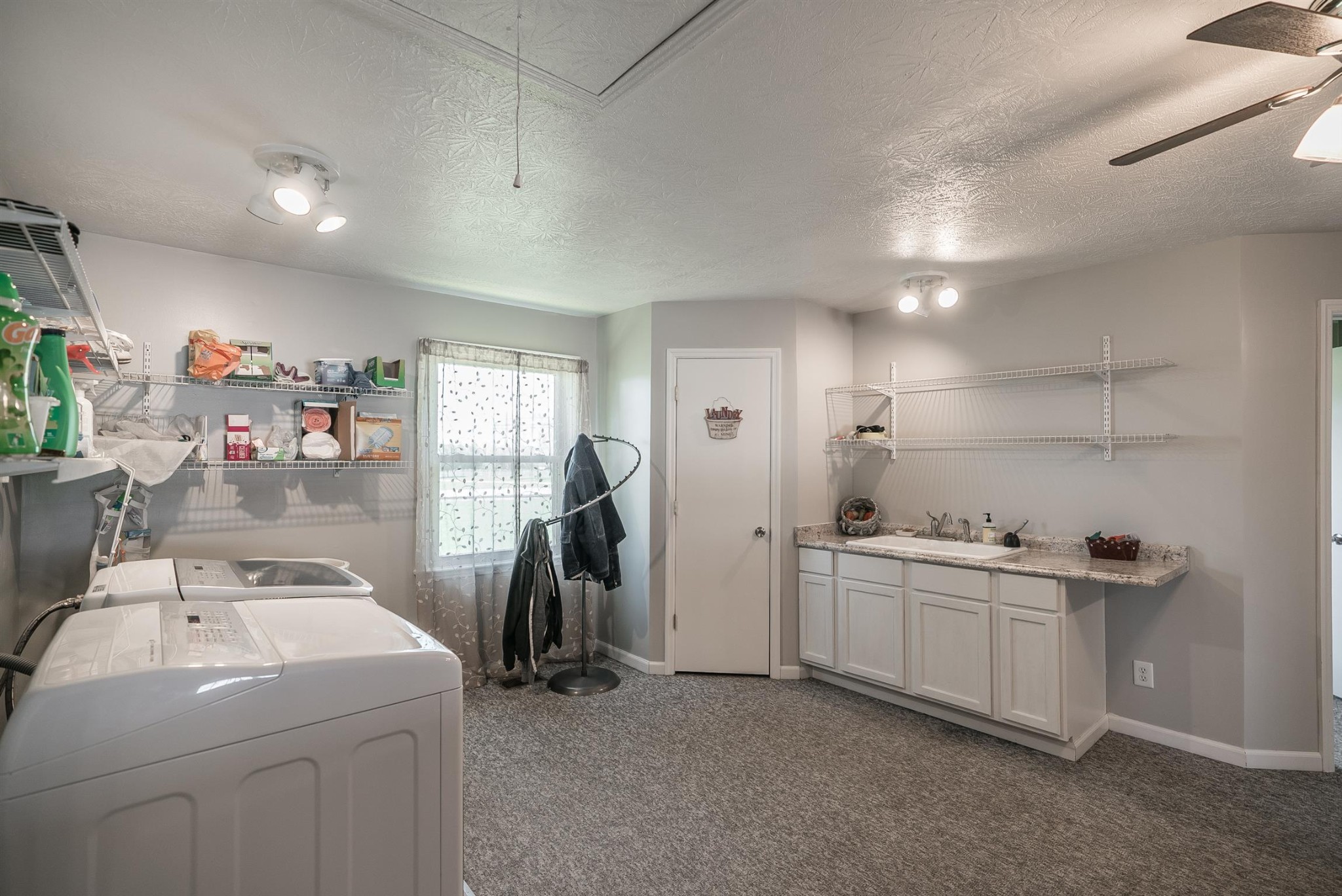 6842 Bethel Road Greenbrier, TN 37073 - Photo 27 of 30 a view of storage and utility room with lots of appliances