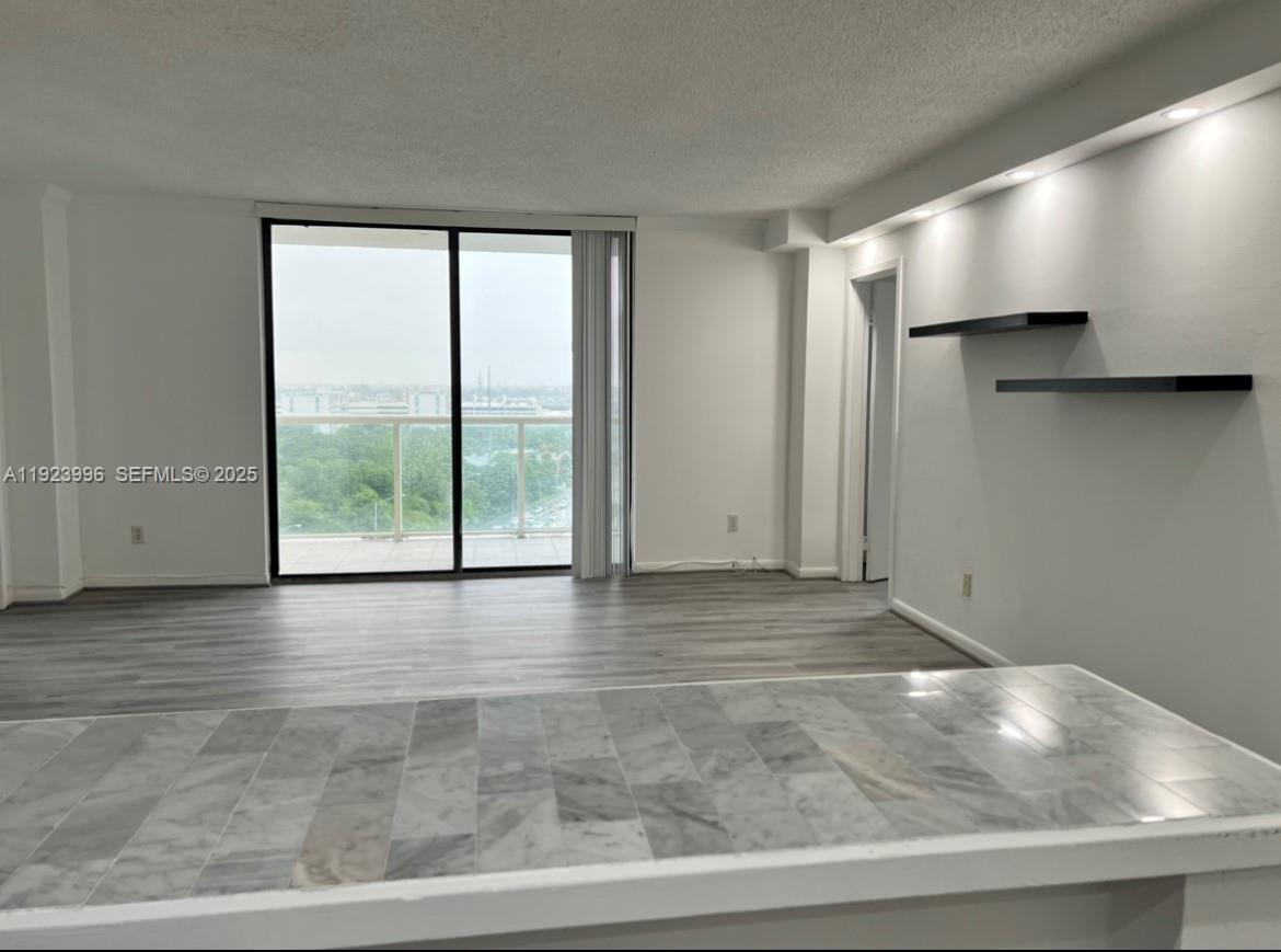 13499 Biscayne Boulevard, Unit 1205 North Miami, FL 33181 - Photo 7 of 32 a view of an empty room with a window