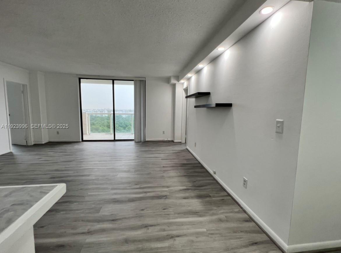 13499 Biscayne Boulevard, Unit 1205 North Miami, FL 33181 - Photo 9 of 32 a view of entryway with wooden floor