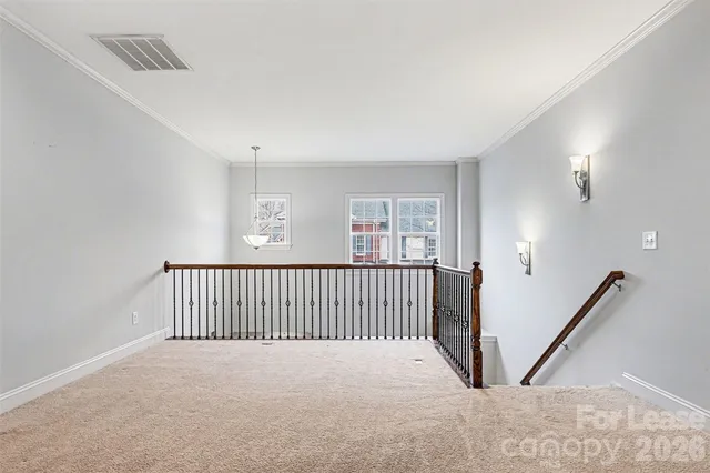a view of a hallway with windows