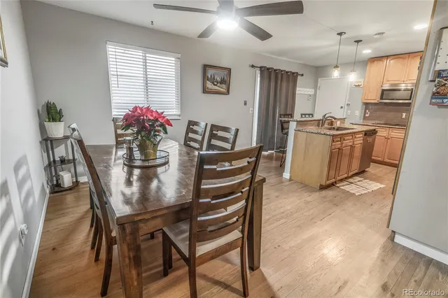 a dining room with furniture and window