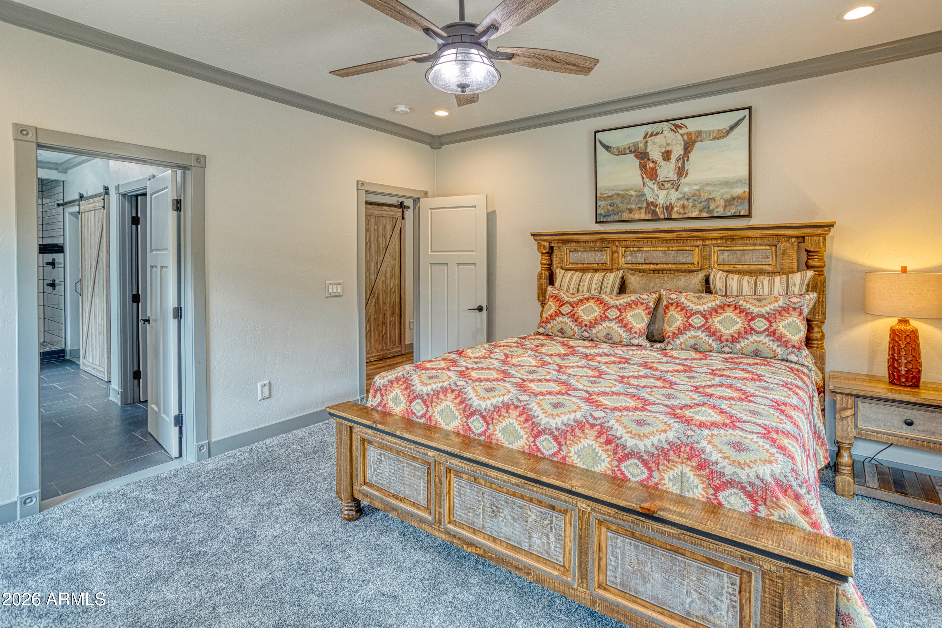 2281 West Edgewater Show Low, AZ 85901 - Photo 23 of 46 a bedroom with a bed and a chandelier