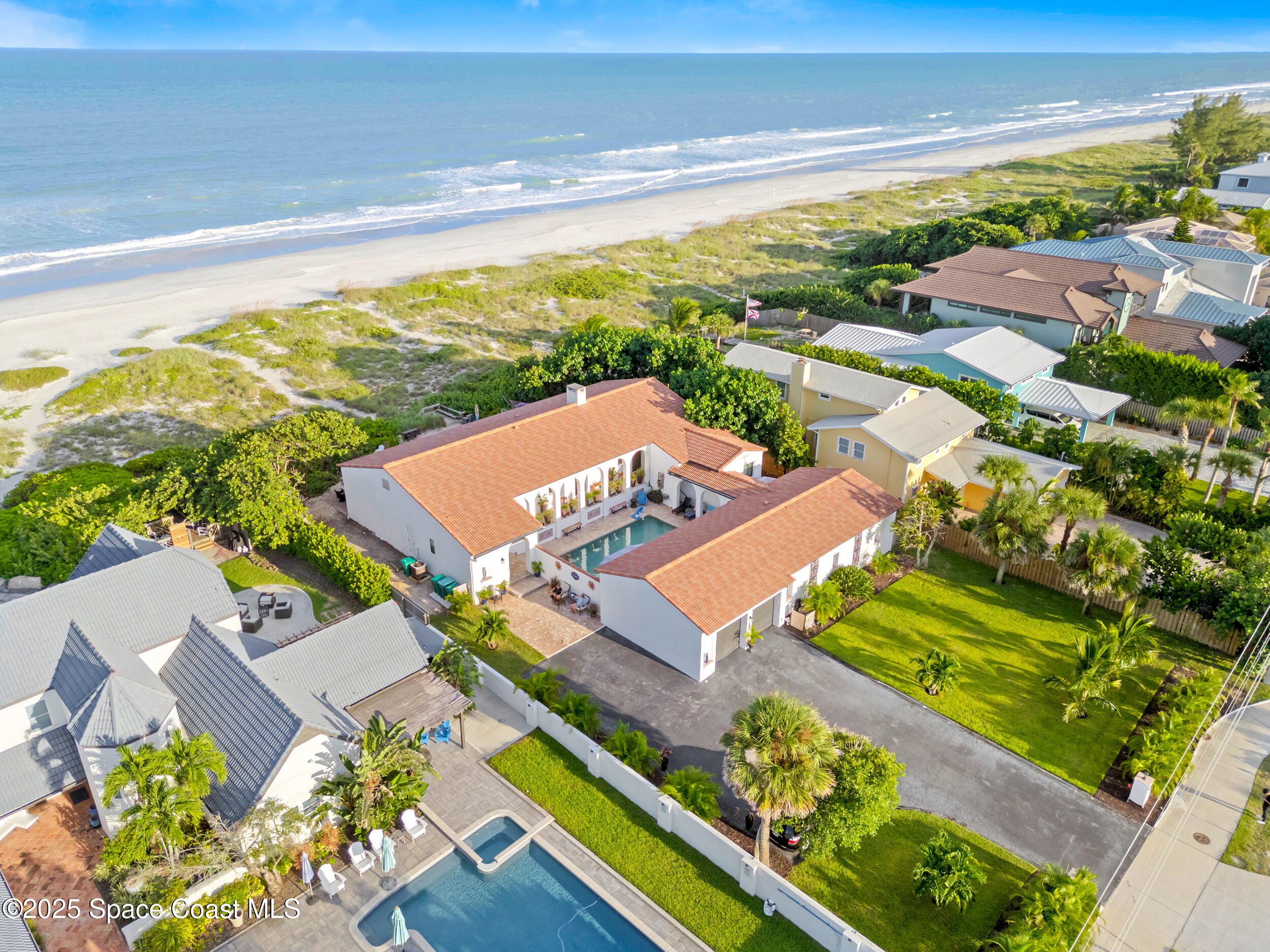 933 South Atlantic Avenue Cocoa Beach, FL 32931 - Photo 1 of 46 an aerial view of a house with a ocean view