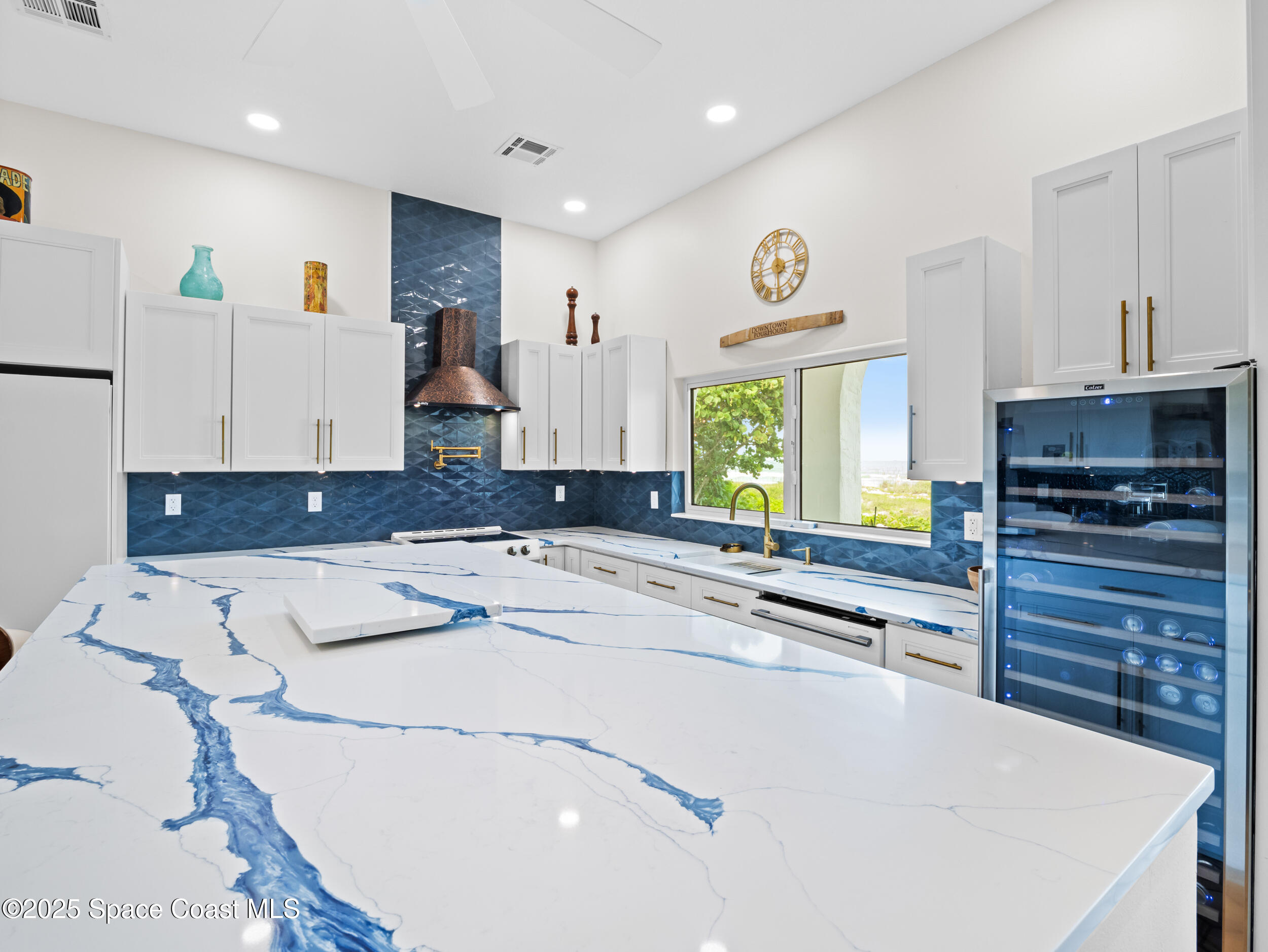 933 South Atlantic Avenue Cocoa Beach, FL 32931 - Photo 14 of 46 a kitchen that has a cabinets and a stove