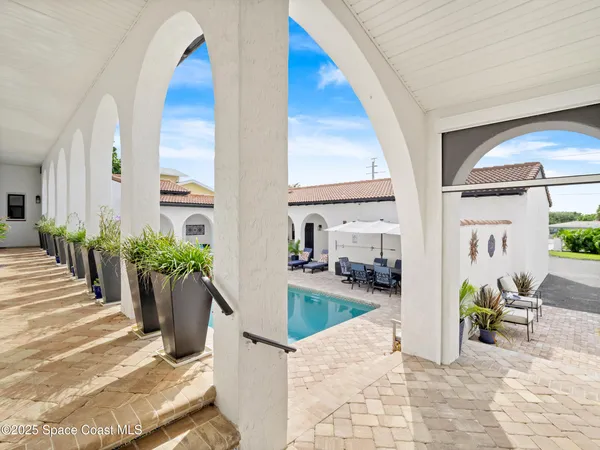 a living room with furniture fireplace and a flat screen tv