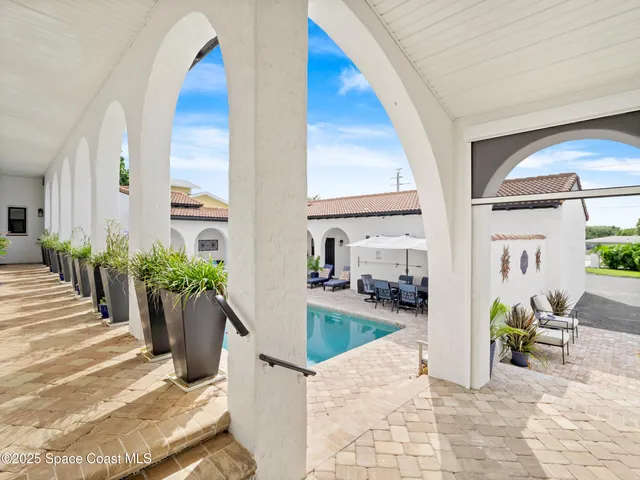 a living room with furniture fireplace and a flat screen tv