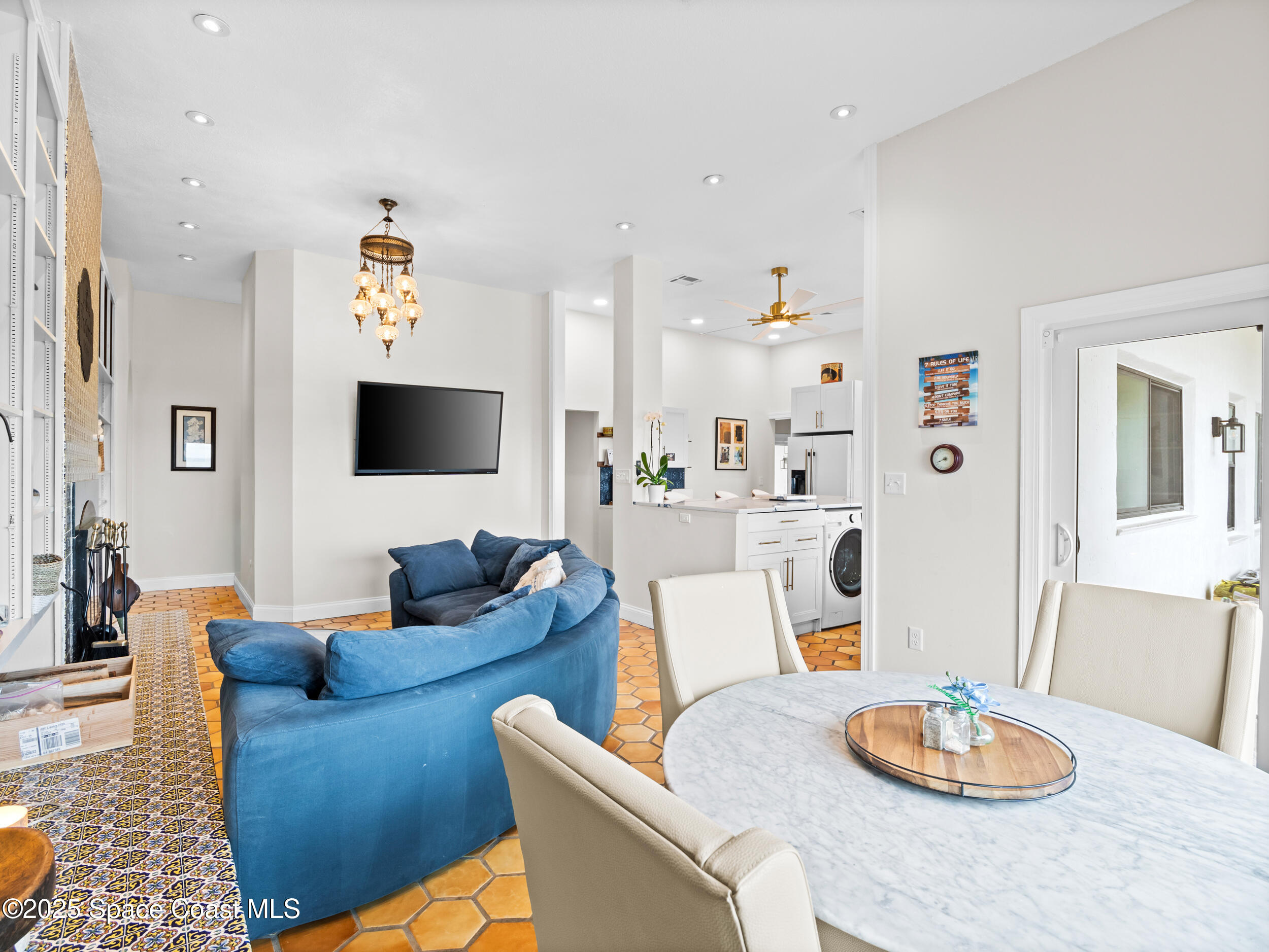 933 South Atlantic Avenue Cocoa Beach, FL 32931 - Photo 18 of 46 a living room with furniture and a flat screen tv