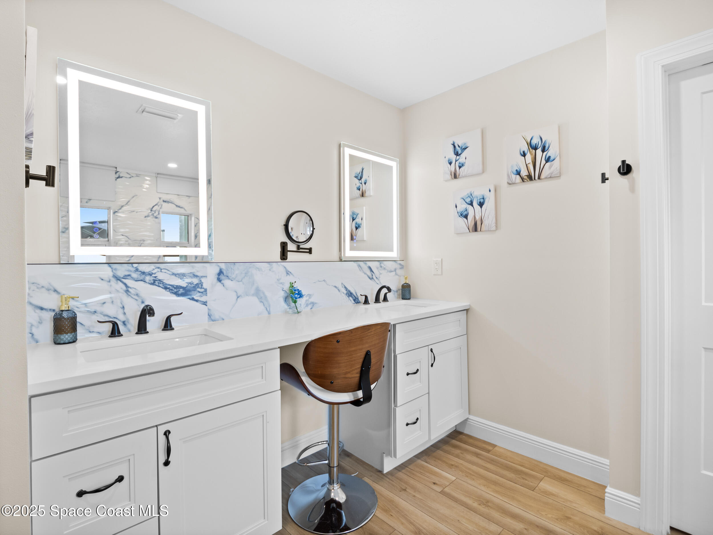 933 South Atlantic Avenue Cocoa Beach, FL 32931 - Photo 19 of 46 a bathroom with a sink and a mirror