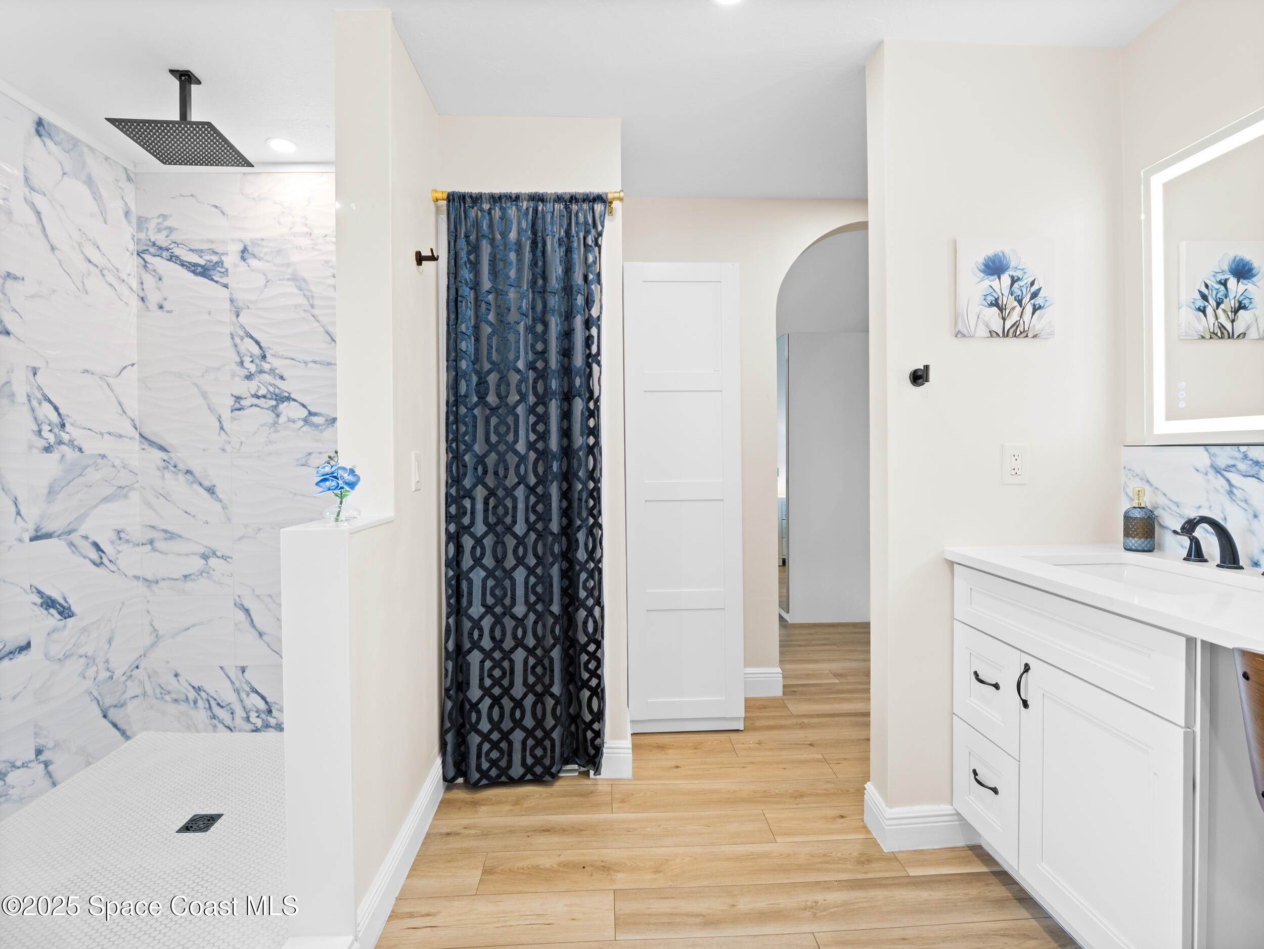 933 South Atlantic Avenue Cocoa Beach, FL 32931 - Photo 21 of 46 a bathroom with a sink and a shower