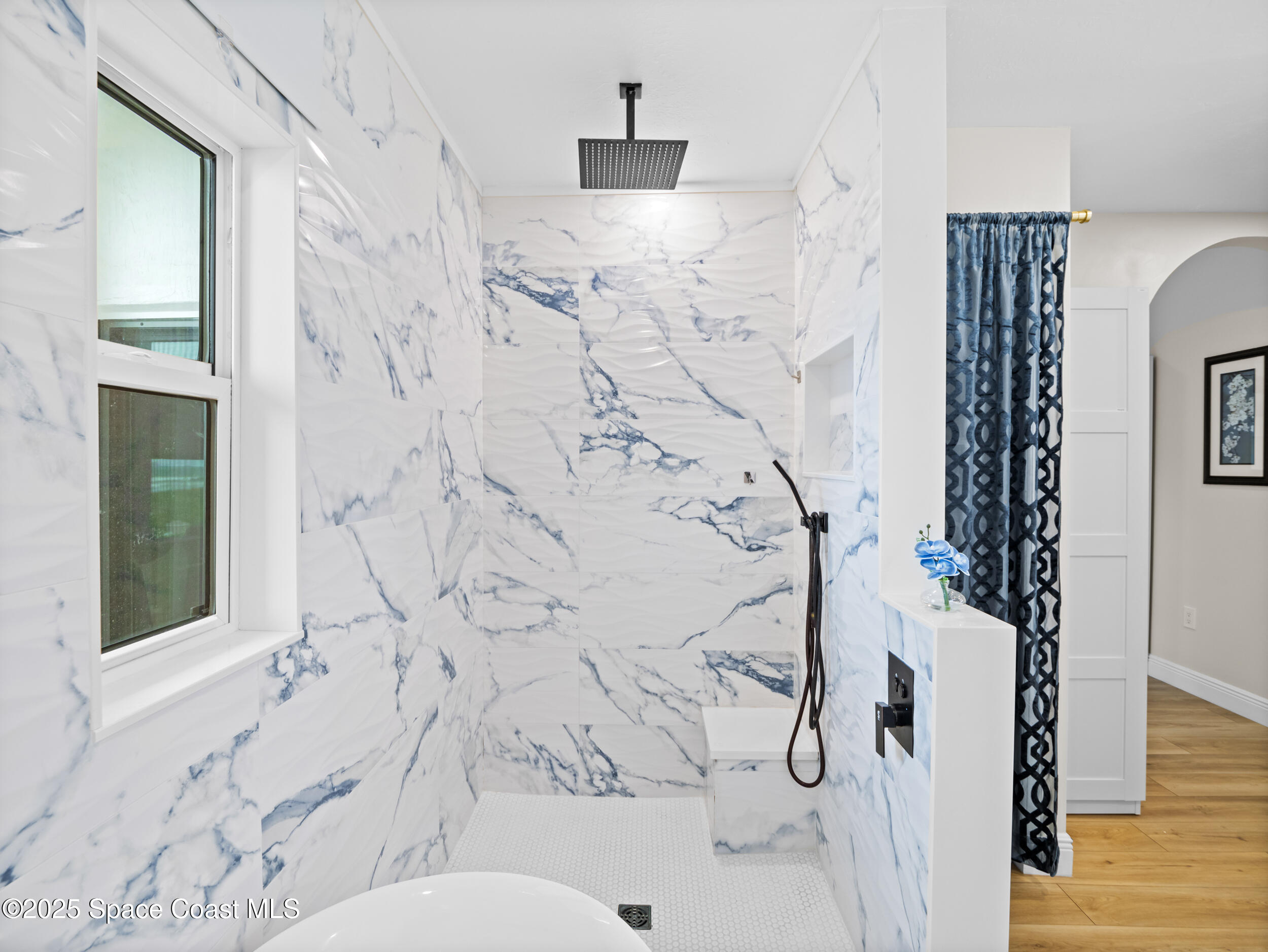 933 South Atlantic Avenue Cocoa Beach, FL 32931 - Photo 22 of 46 a bathroom with a toilet sink and shower