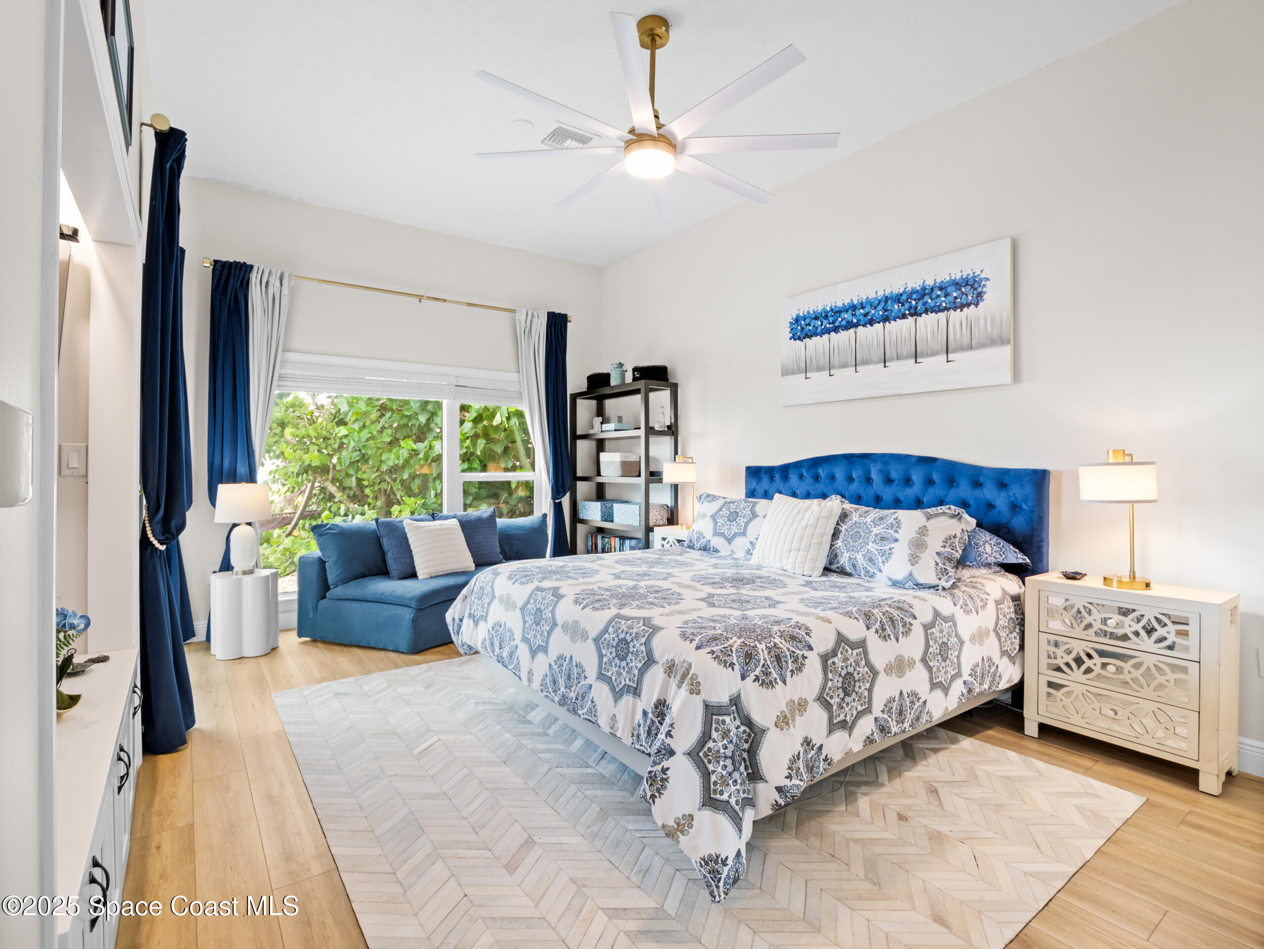 933 South Atlantic Avenue Cocoa Beach, FL 32931 - Photo 24 of 46 a bedroom with a large bed and a window