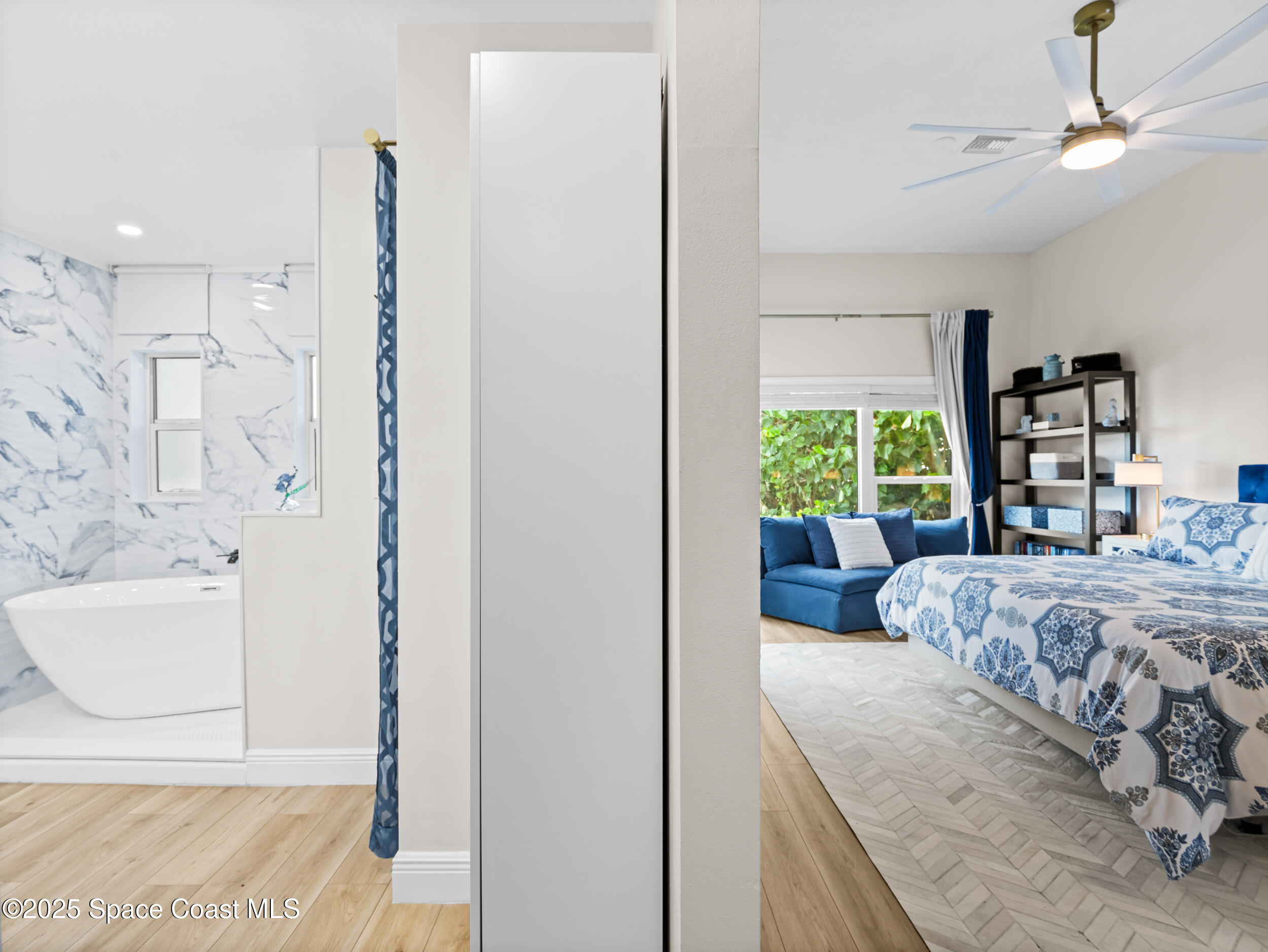 933 South Atlantic Avenue Cocoa Beach, FL 32931 - Photo 27 of 46 a bedroom with a bed and a window