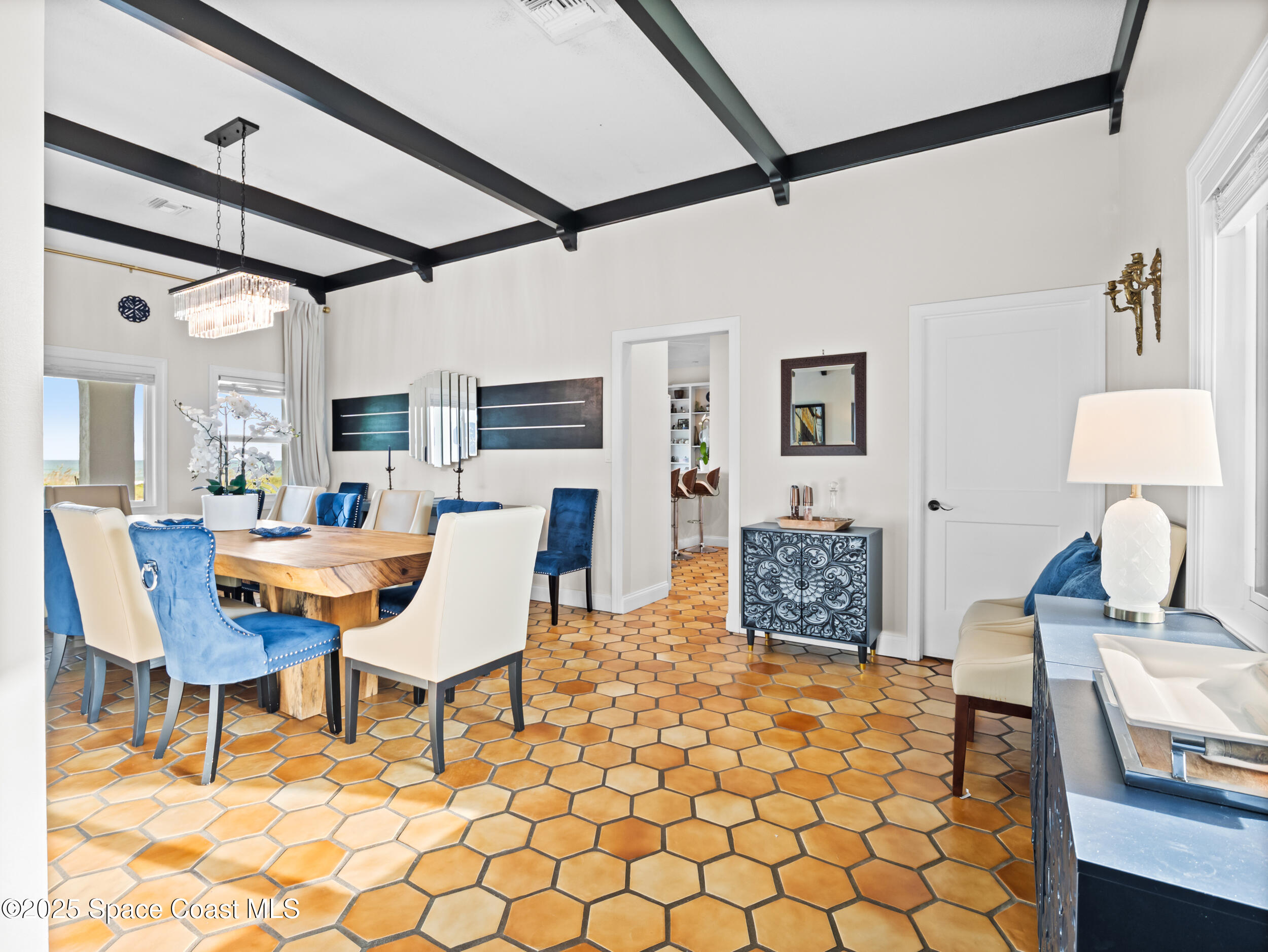 933 South Atlantic Avenue Cocoa Beach, FL 32931 - Photo 30 of 46 a living room with furniture and a table